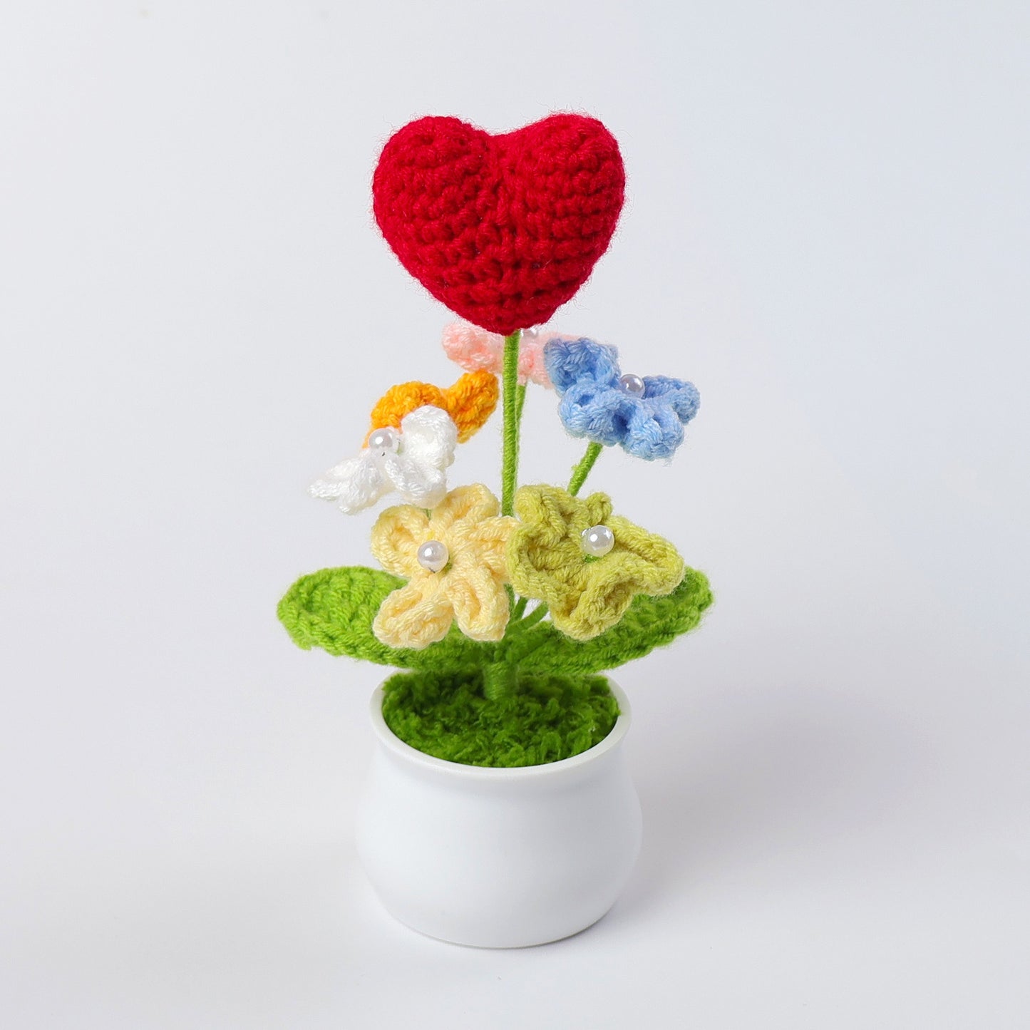 Heart with flowers pot plant